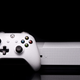 an xbox one s against a black background